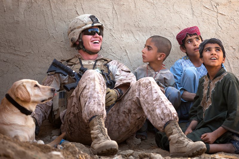 U.S. marine talking to Afghan children (2011).